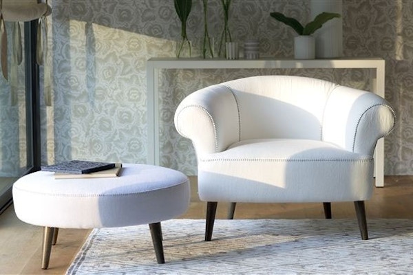Designers Guild The Stitch Collection has a contemporary twist on the Chesterfield sofa, with a feature stitch detail on the upholstered arms and seat. The range includes sofas, chairs and stools.