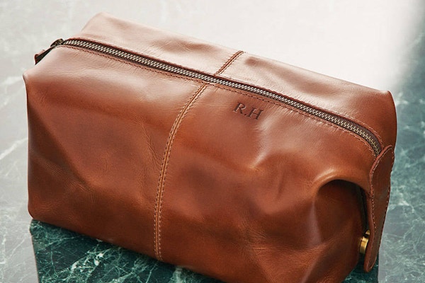Not On The High Street Handmade to combine beautiful buffalo leather and a vintage-inspired design, this personalised washbag is subtle and chic, perfect for nights away.