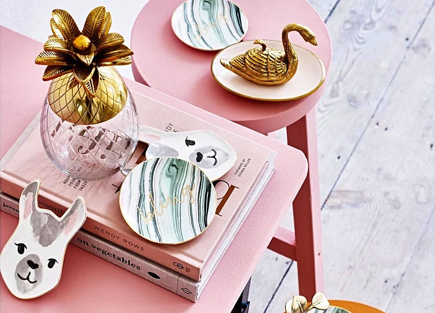 Oliver Bonas For design-led home accessories or furniture, look to Oliver Bonas that sells goodies, like this Pineapple Gold and Glass Storage Box.