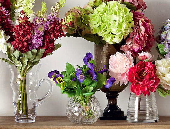 OKA Perhaps the most realistic fake flowers online come from high end design firm OKA. Certainly their vases are some of the most beautiful.
