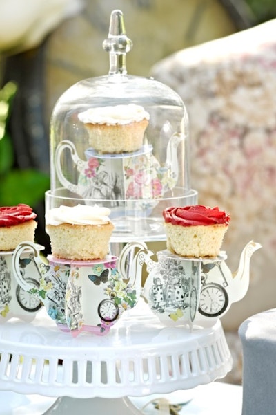PARTY PIECES Host a coffee morning with a difference. Adopt a Mad Hatters tea party theme and buy these mini teapot shaped cake stands.