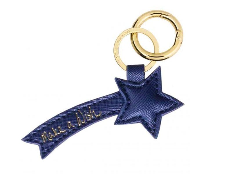 MAKE A WISH BAG CHARM This unusual and chic navy-blue charm will refresh the look of any handbag.