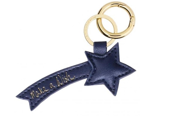 MAKE A WISH BAG CHARM This unusual and chic navy-blue charm will refresh the look of any handbag.