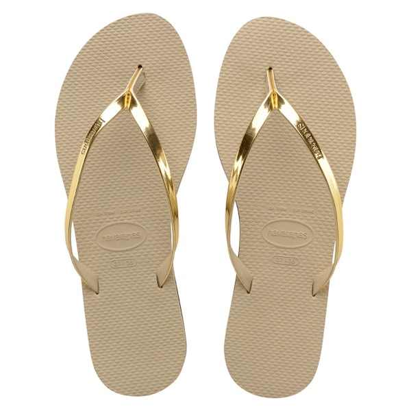 Havaianas Gold Flip Flops You’re on holiday: you need to be as comfortable as you are stylish, right? These flip-flops tick both boxes.