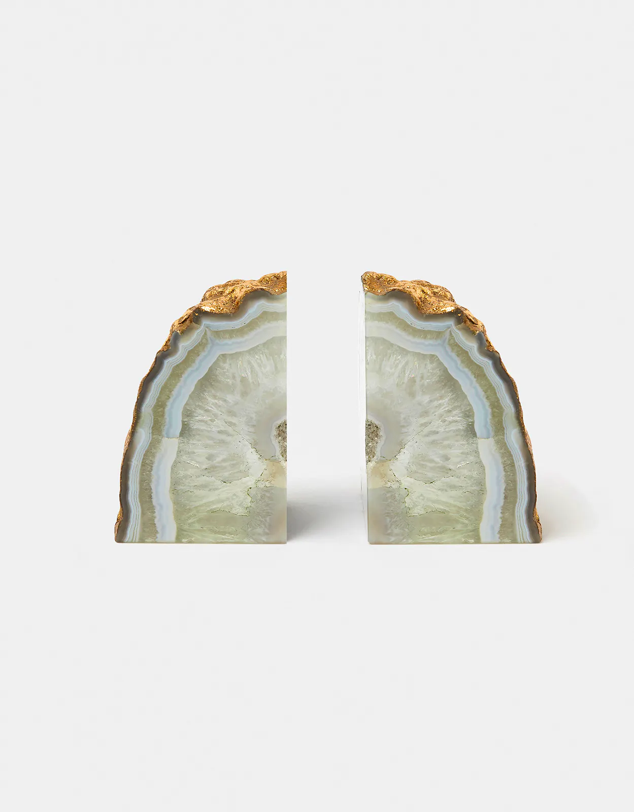 Monsoon Bring some glamour to your bookshelf with this pair of agate book ends, featuring polished faces and a gold-foil covered raw edge for a shimmering finish.