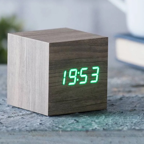 Gingko With this Cube Click Clock, just click your fingers, clap your hands or gently tap your bedside table and the time, date and temperature will alternately appear for you in green LED colour. £29