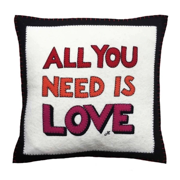 All You Need Is Love cushion, £95 – Jan Constantine Jan Constantine creates fantastically bold wool appliqued pieces and we love this fun cushion, as well as its visual reminder!