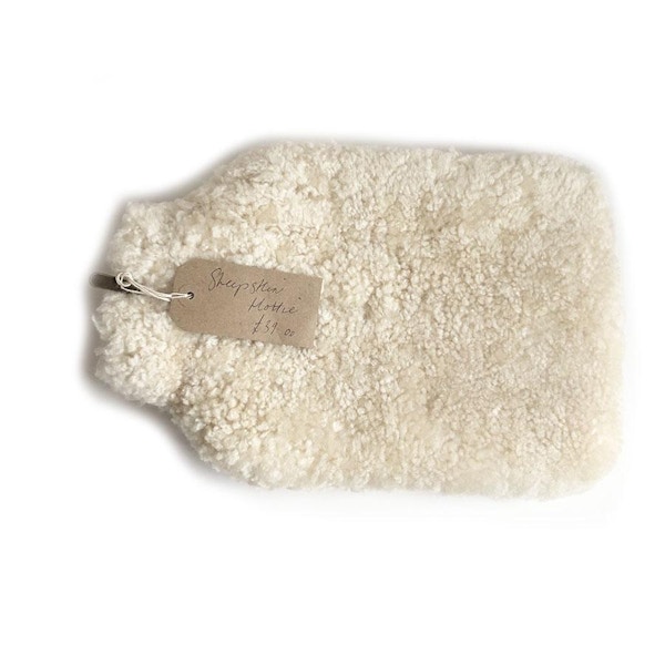 Sheepskin Hot Water Bottle in Charcoal, £39, King's Farmers If you err on the side of classic cosy when it comes to your hot water bottle, this sheepskin beauty is the stuff of huggable dreams.