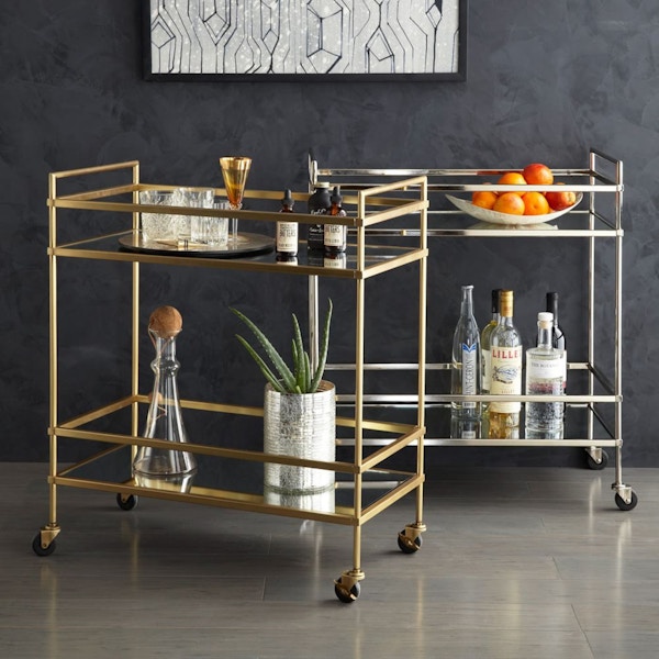 West Elm, Terrace Bar Cart This Art Deco-style antique brass drinks trolley is so pleasing it wouldn’t look out of place in the fastidious Hecule Poirot’s drawing room. Just add some sparkling crystal glasses and pretty, gem-hued bottles. £399.