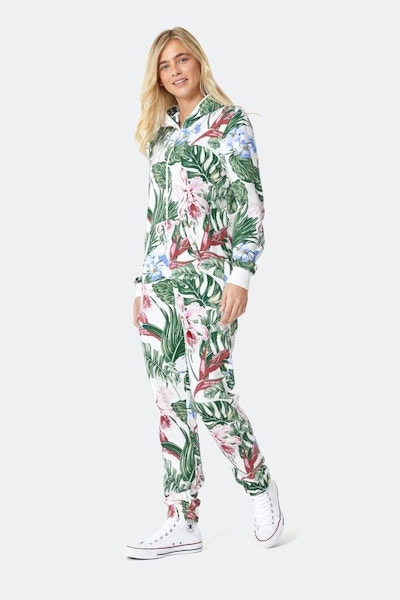TROPICANA JUMPSUIT OFF-WHITE This summery jumpsuit serves up palm trees, banana leaves and bold florals. We will take ours with a Pina Colada, please.