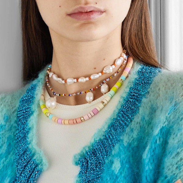 Roxanne Assoulin: Soft Serve Enamel And Gold-Tone Necklace, £185 The gorgeous gelato tones of this enamel and gold necklace from Roxanne Assoulin make it the perfect holiday accessory. The glossy enamel beads are offset with glinting gold highlights – perfect for catching the sun’s rays. The ingenious magnetic clasp makes it a doddle to get on and off. Perfect paired with summer whites.