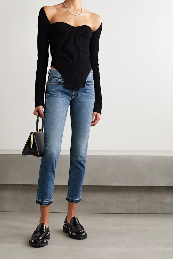 Model In Capri Jeans, Black Off-shoulder Shirt