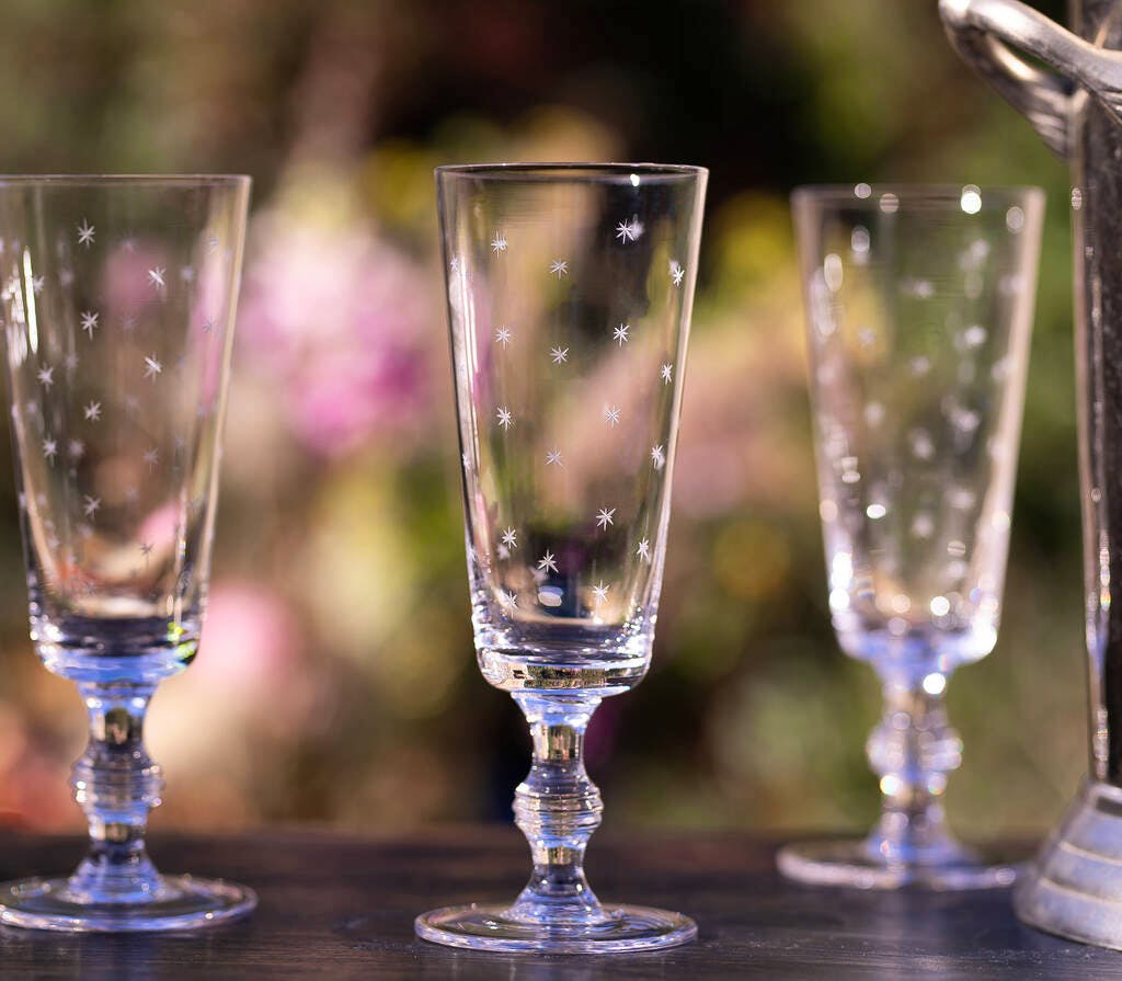 Not on The High Street Set Of Four Champagne Flutes With Stars Design, £55