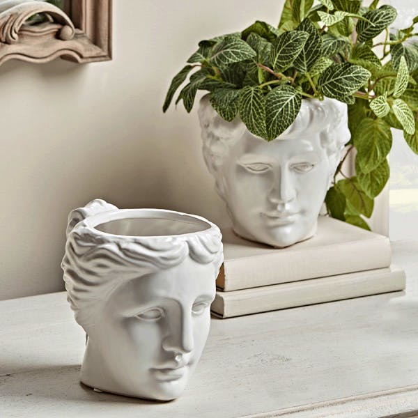 Two Standing Head Planters £45