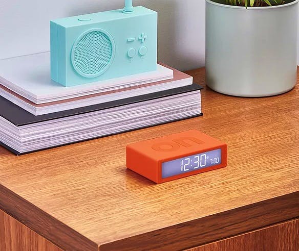 Lexon Flip+ Radio Controlled LCD Digital Alarm Clock, Orange. £40