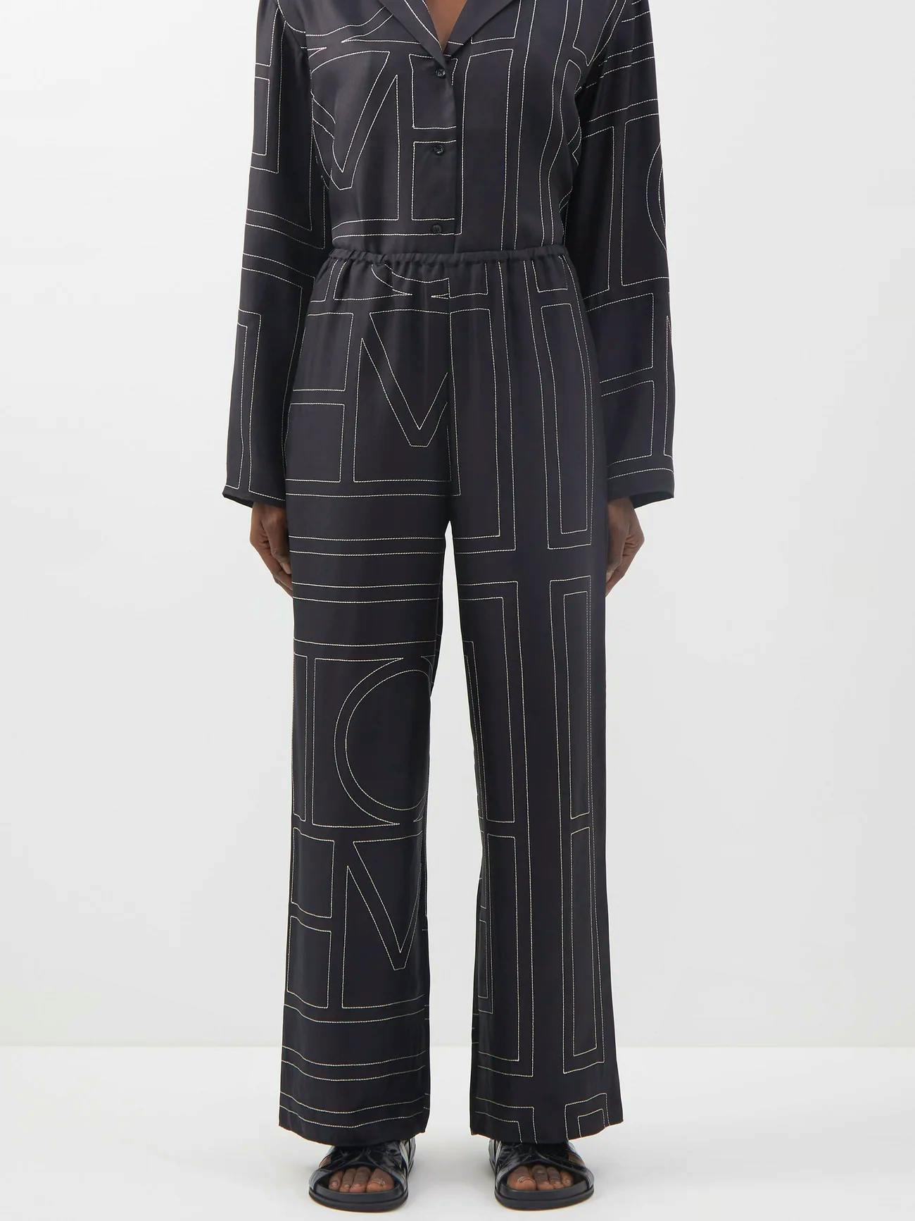 Toteme Monogram Embroidered Silk Pyjama Top, £520, Monogram Embroidered Silk Pyjama Trousers, £510