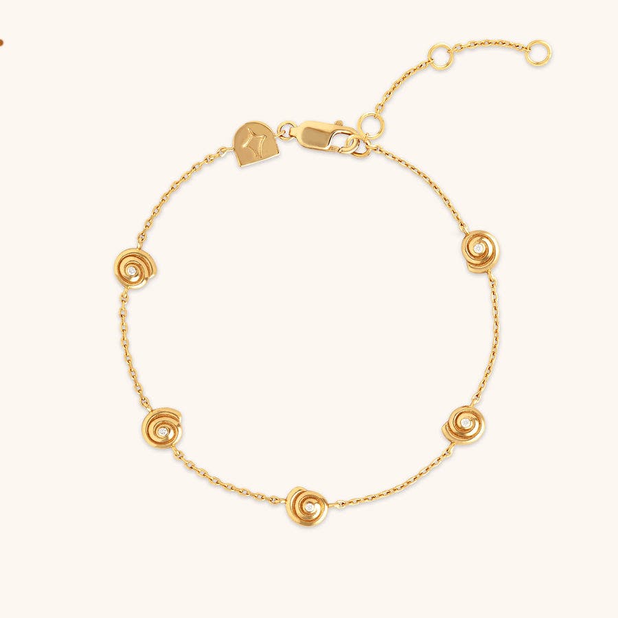 Astrid & Miyu Shell Crystal Charm Bracelet In Gold, £70