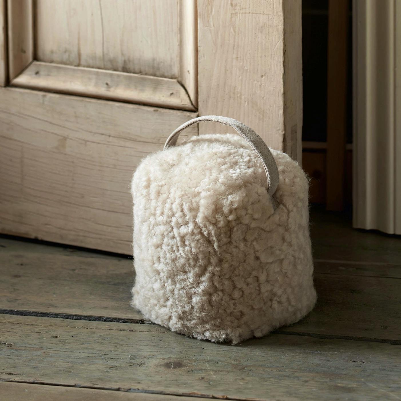 The White Company Curly Sheepskin Doorstop, £45