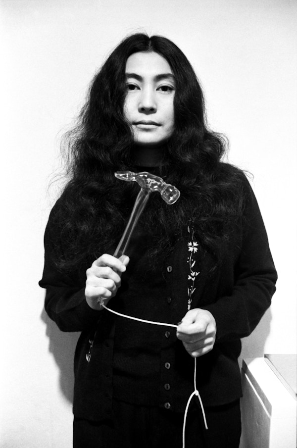 Yoko Ono With Glass Hammer 1967 From HALF-A-WIND SHOW, Lisson Gallery, London, 1967. Photograph Clay Perry © Yoko Ono