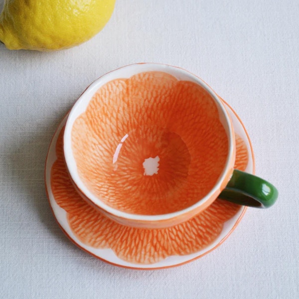 Spicer & Wood Orange teacup and saucer, £23