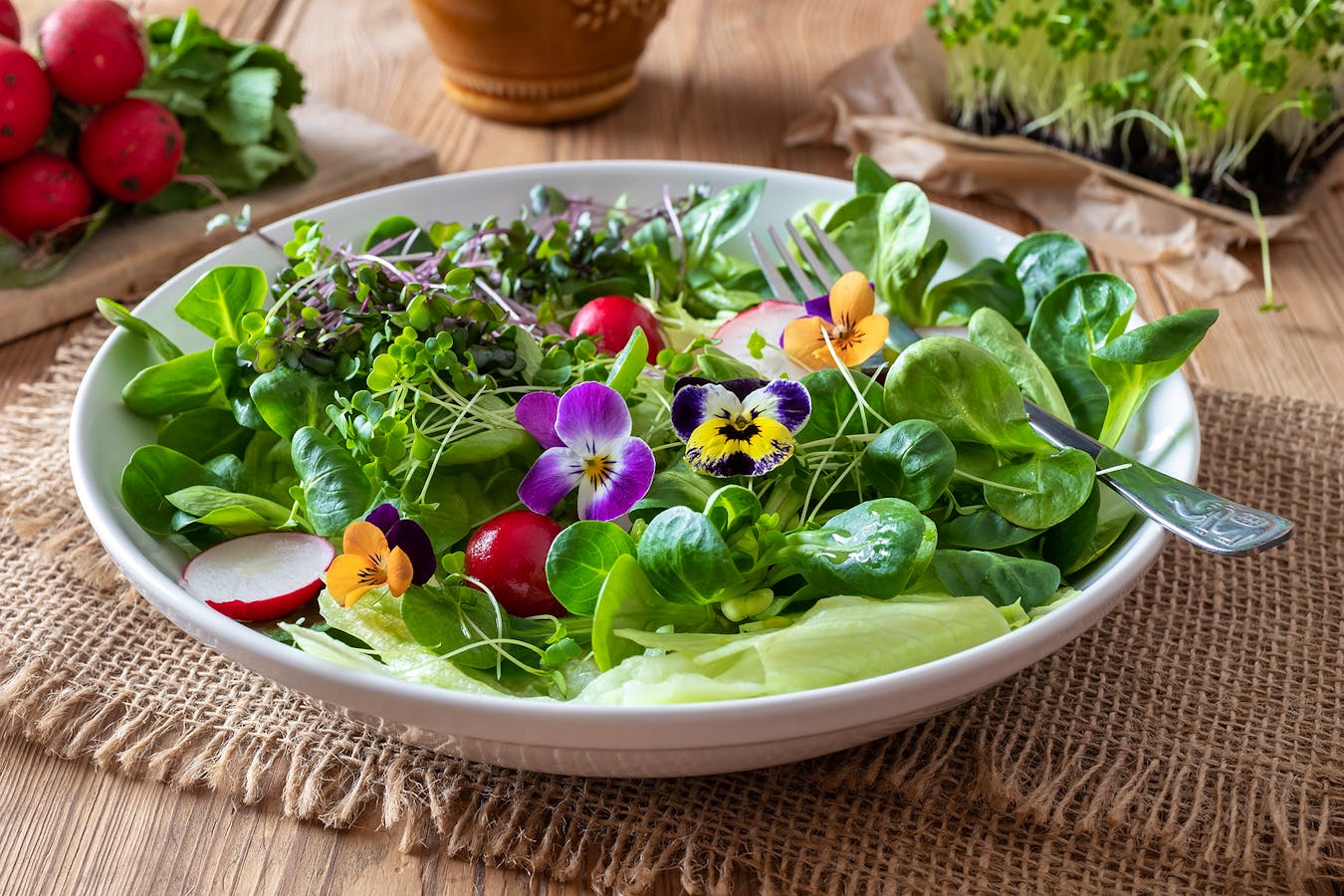 Bigstock-Salad-With-Edible-Pansies-And--287480701