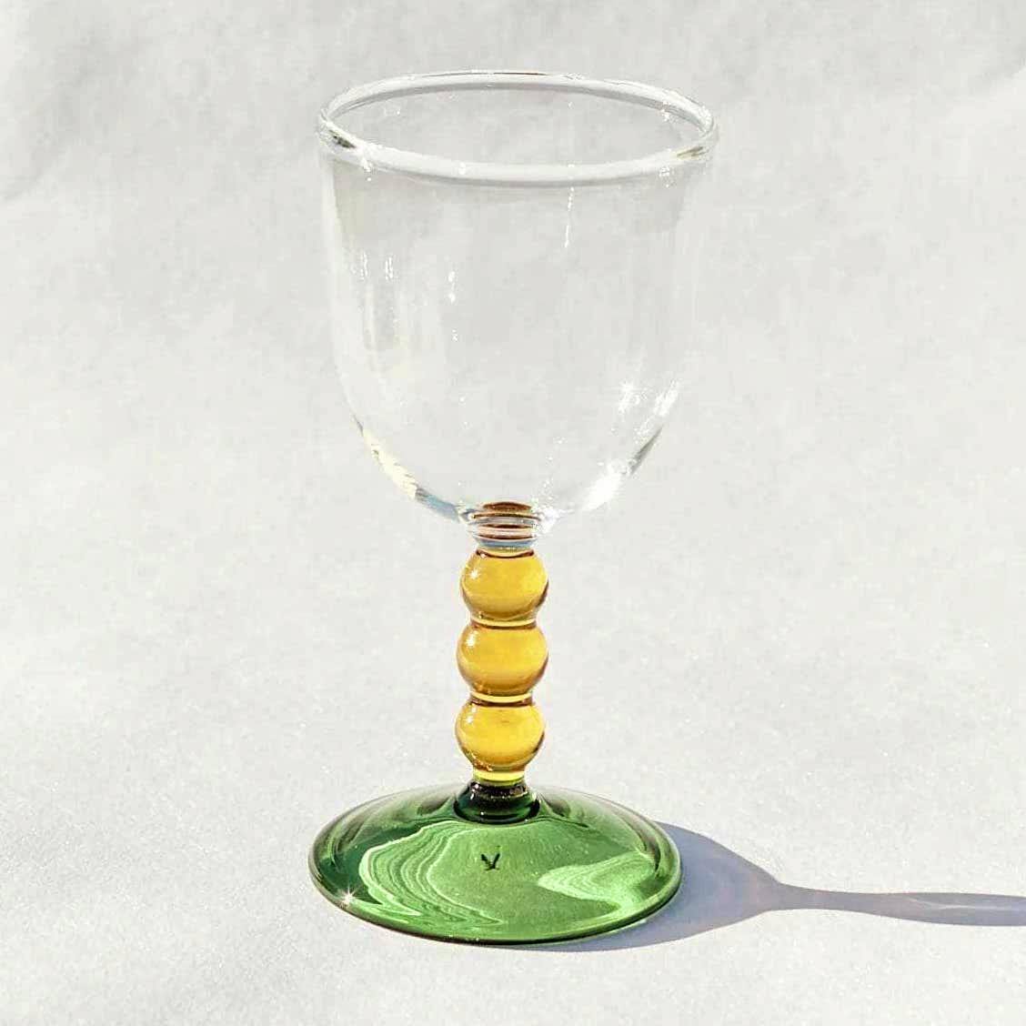 Maison Flaneur Hand Blown Circle Stem Wine Glass in Yellow/Green, £26