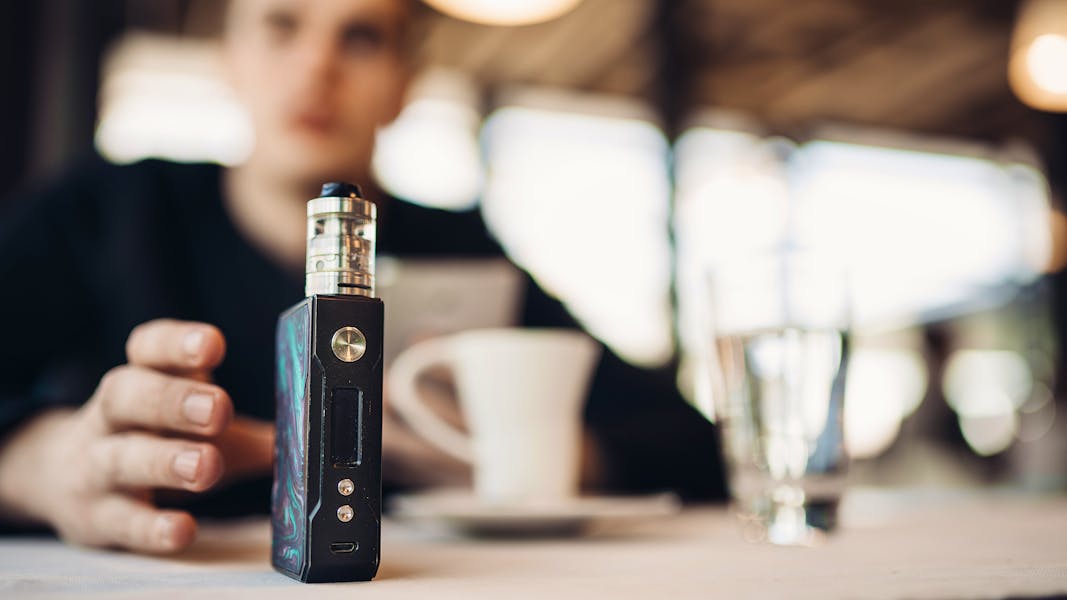 Bigstock-Using-Electronic-Cigarette-To--227409013