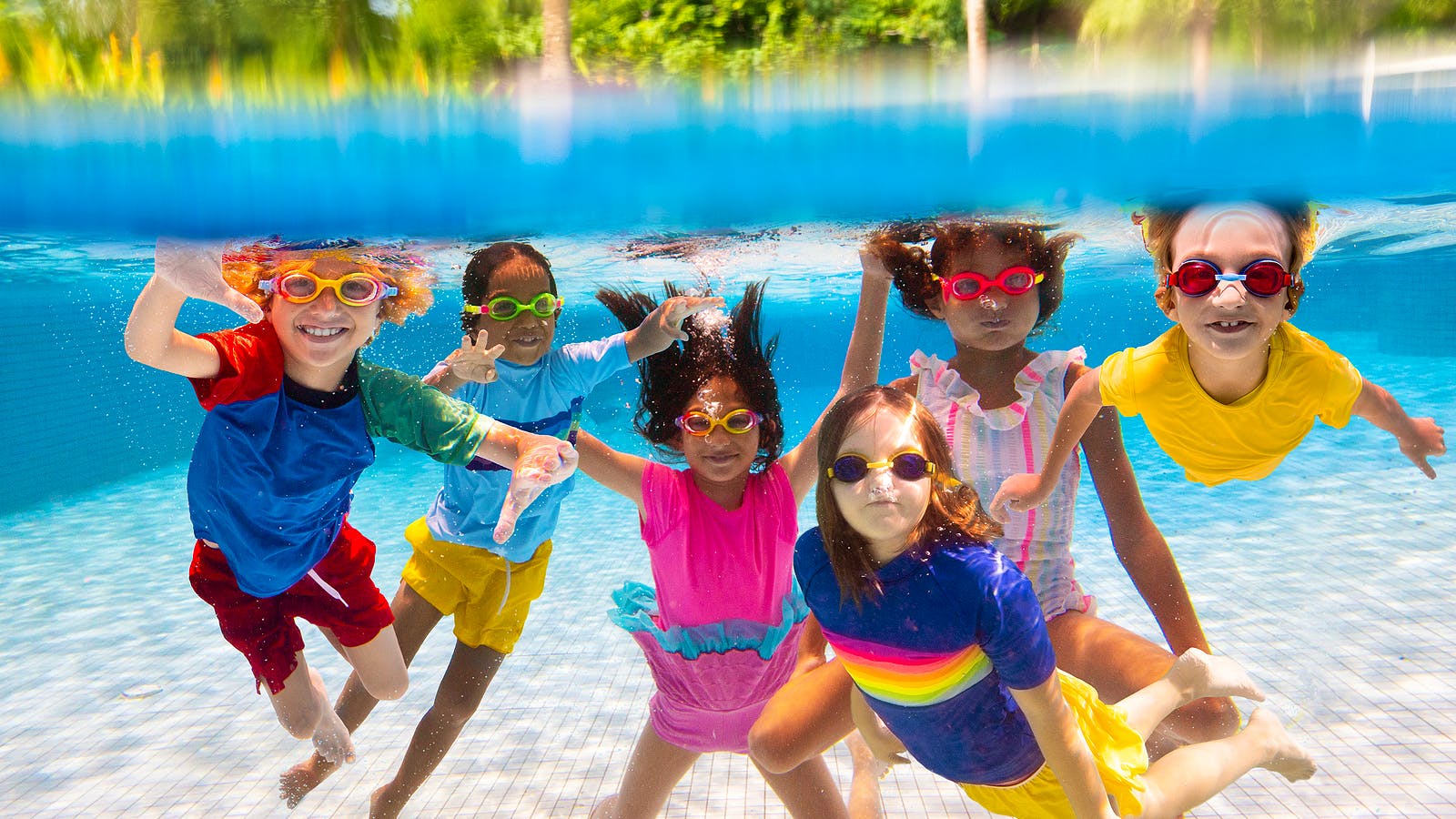Bigstock-Group-Of-Kids-Jump-Into-Swimmi-476616453