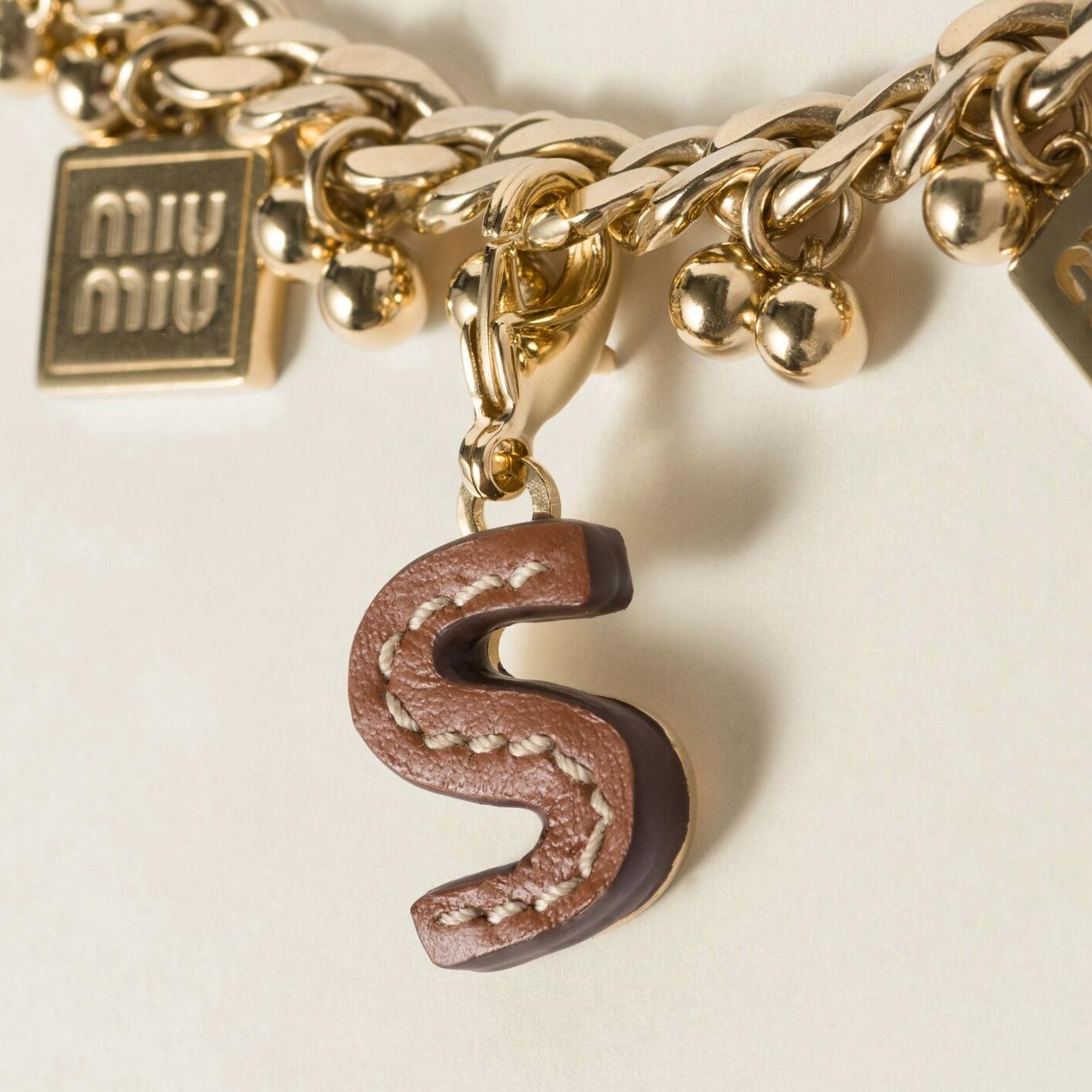 Miu Miu Leather And Metal Letter Charm, £195