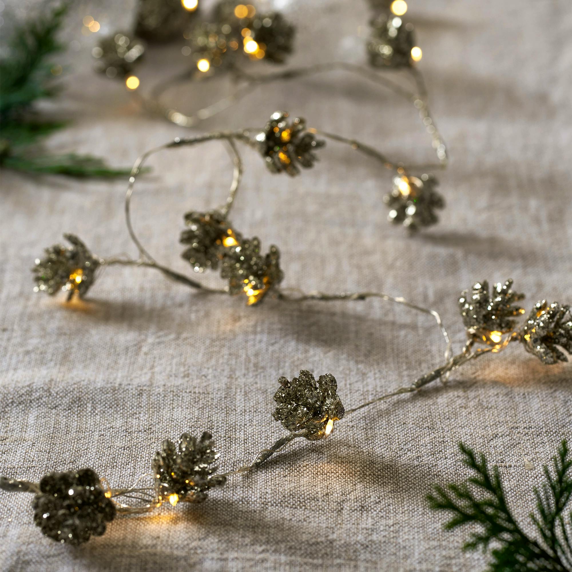 The White Company Pre Lit Fir Cone Garland – 30 Bulbs, £35