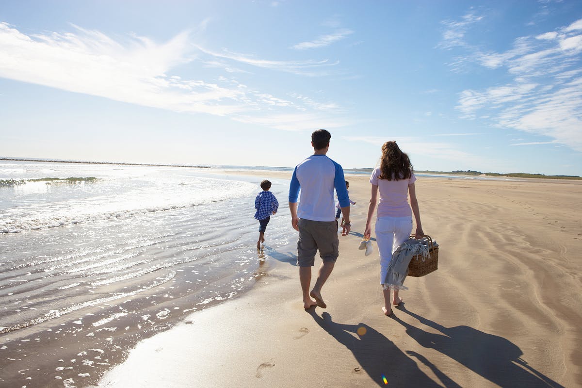 Bigstock-Rear-View-Of-Family-Walking-Al-50069339