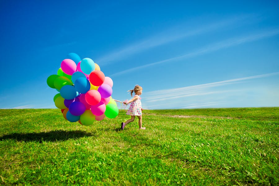 Bigstock-Happy-little-girl-holding-colo-50517941