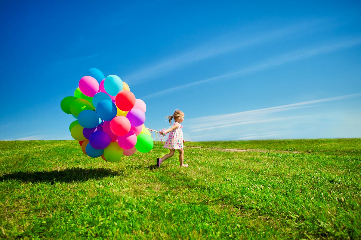 Bigstock-Happy-little-girl-holding-colo-50517941