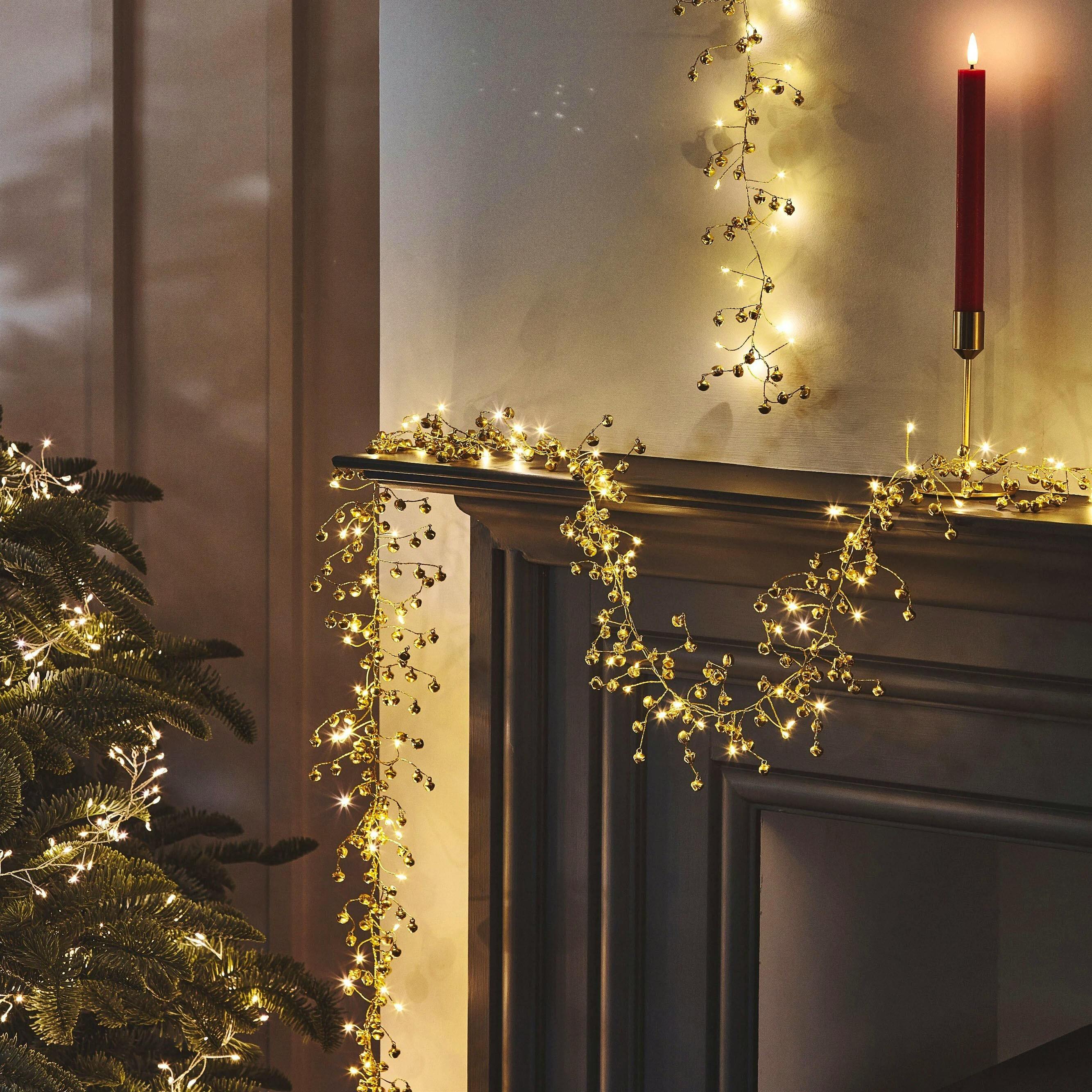 Oliver Bonas Golden Bell Christmas Garland with Lights, £35