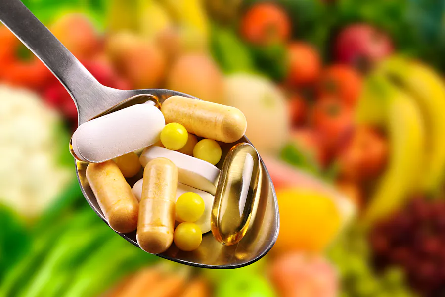 Bigstock-Spoon-With-Dietary-Supplements-70069831