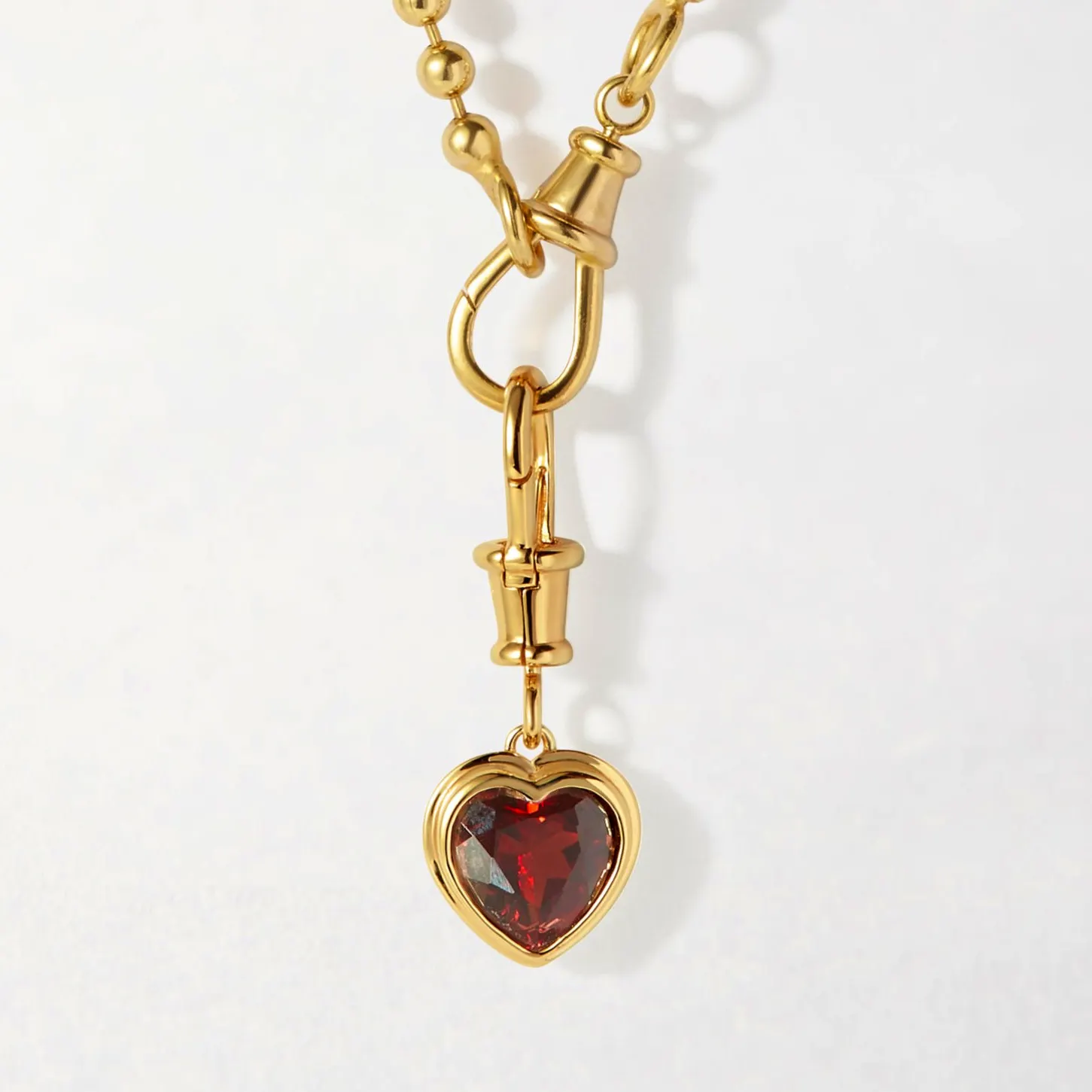 Edge Of Ember Heart Red Garnet Necklace, £185 – £215