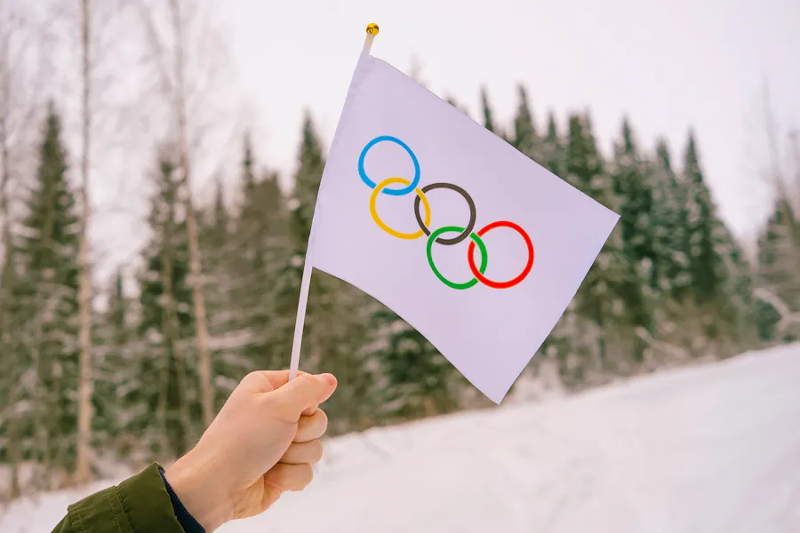 Bigstock-The-Olympic-Flag-Small-In-Han-442787582