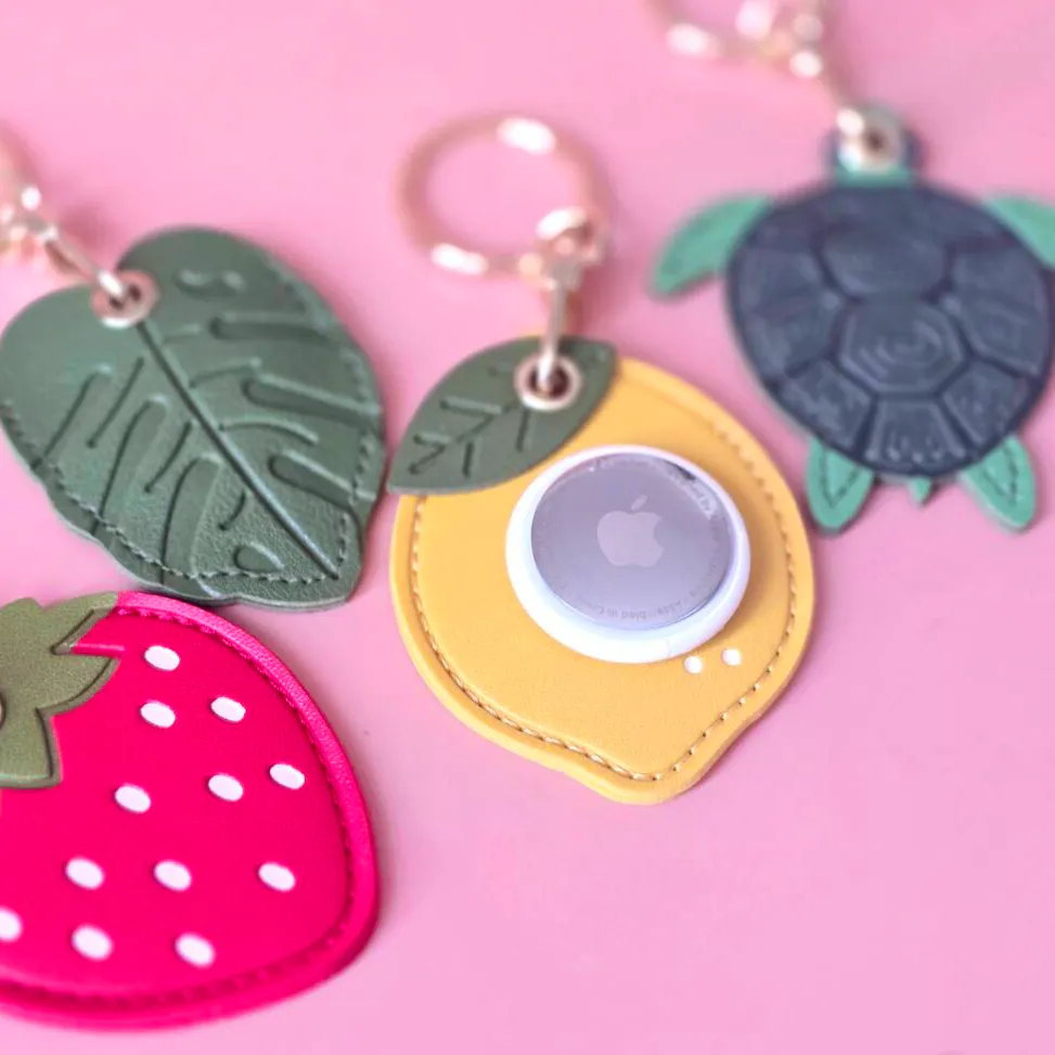 Not On The High Street Rebel and Wild Palm Leaf Airtag Holder Keyring, £9.99
