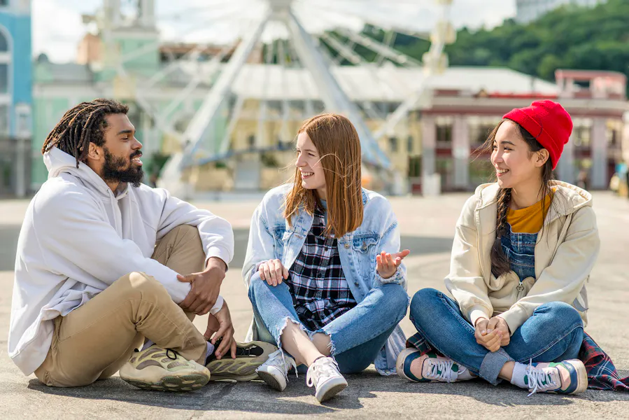 Happy Group Sitting On Outdoor Floor Freepik