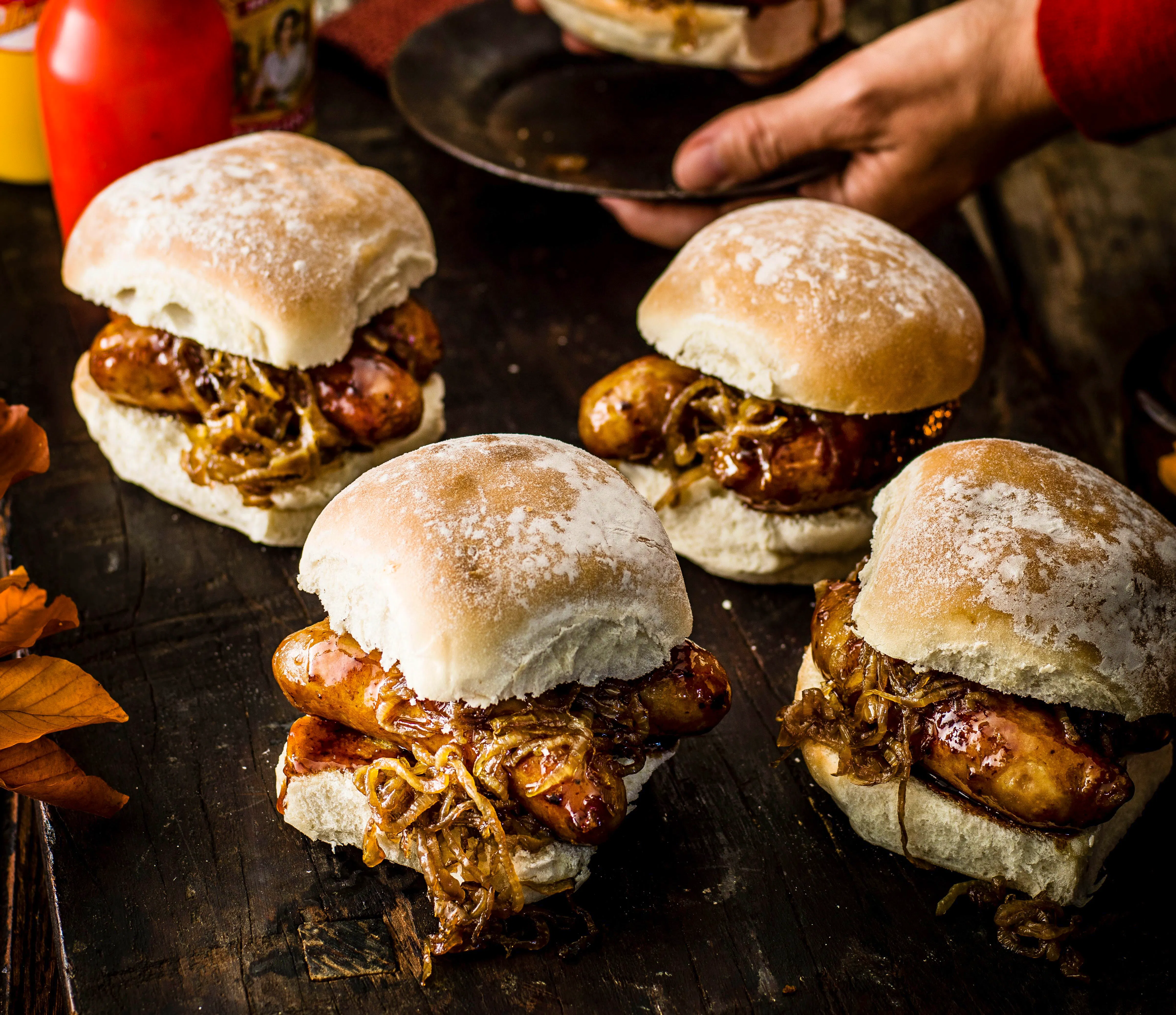 Sticky Sausage Baps With Beer Braised Onions