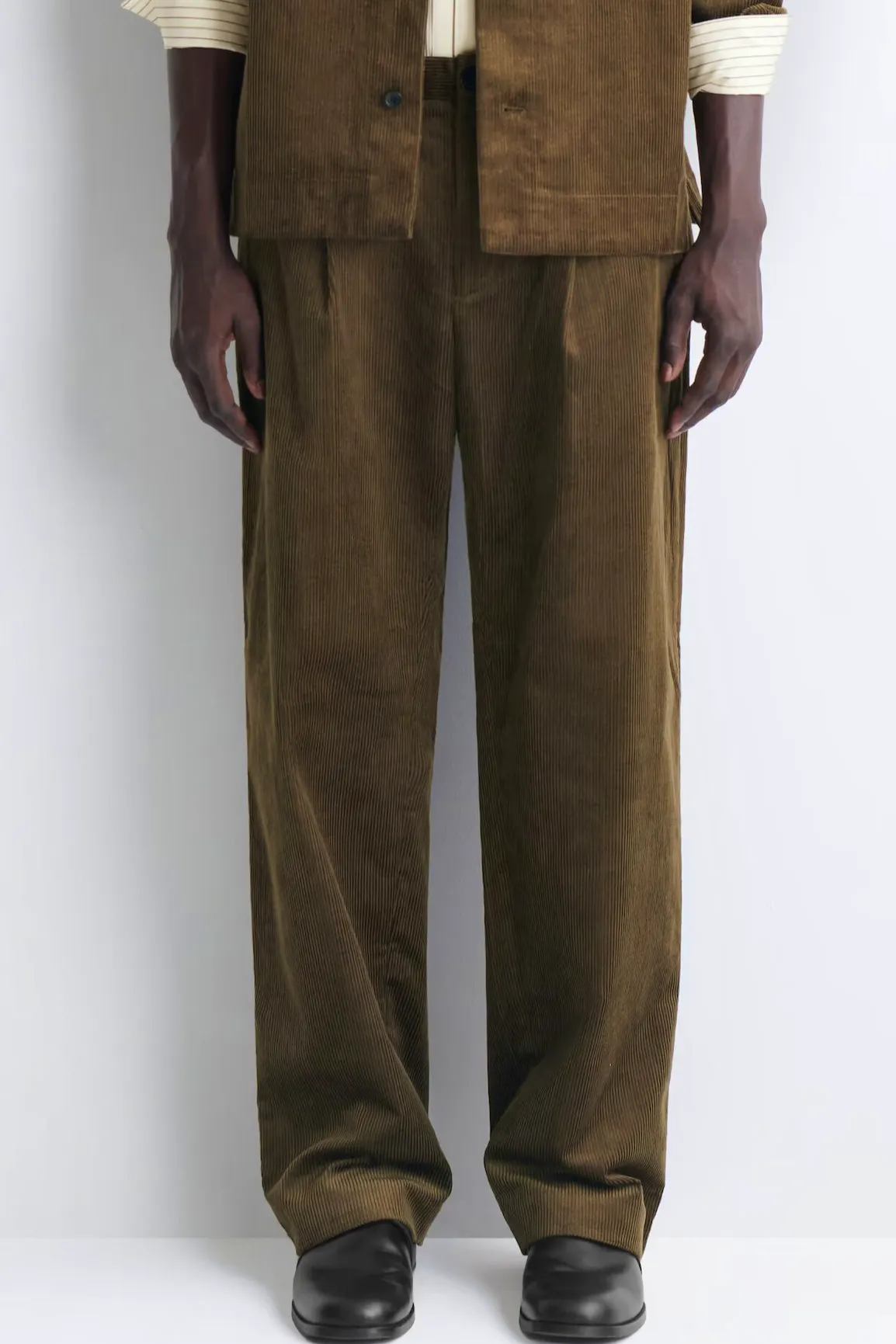 Cos Pleated Relaxed-Fit Tapered Corduroy Trousers, £95
